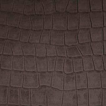 Dark brown printed leather texture with repeating rectangular scales, horizontal rows, and subtle distressed details creating a natural finish.